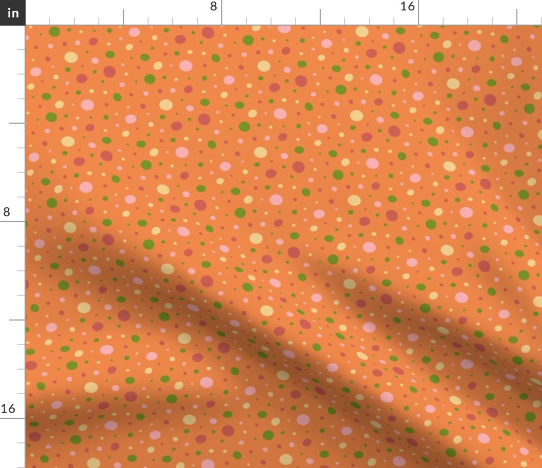 Pink, red, green, and yellow dots on an orange background