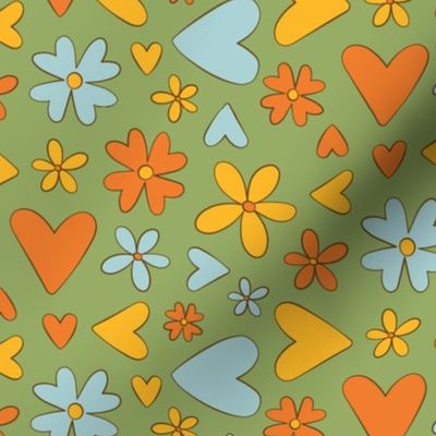 Cute blue, orange, and yellow hearts and flowers on a green background