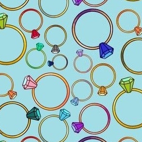 Multicoloured rings on aqua background 