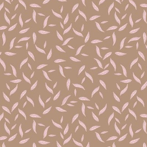 Pink leaves on beige background