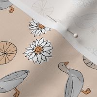 Chasing ducks in a pond sweet spring nursery design kids duckpattern boho mallard friends lillies and leaves soft cream blush orange gray