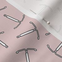 IUD birth control contraception in pastel pink