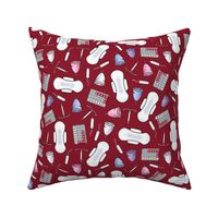 The pill, tampons, IUDs, pads and cups in  blood red