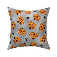 starry eyed and winking pumpkin toss light gray