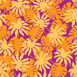 Monstera tropical leaves in orange, yellow and purples