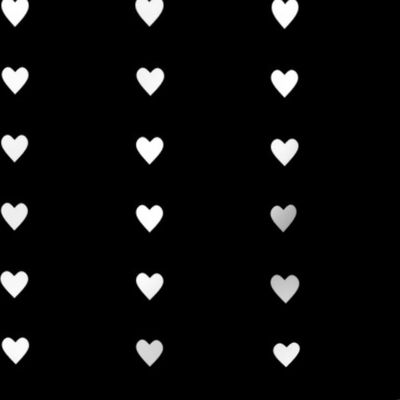 Line of white hearts on black backgound