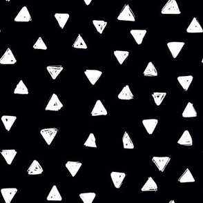 small white triangles black background