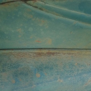 Patina on old car closeup with kaleidoscope repeat blue verdigris 