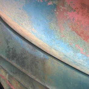 Patina on old car closeup with kaleidoscope repeat blue pink red yellow 