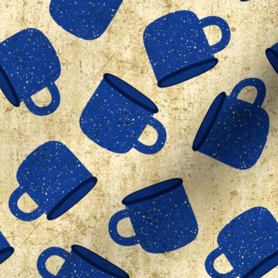 Classic Blue Speckled Camp Mug on Textured Beige