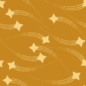 Golden stars on sand background 