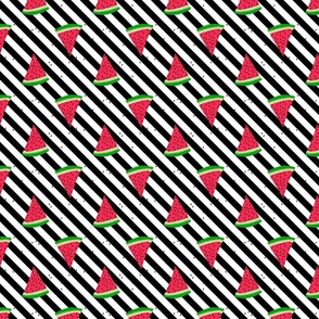 Watermelon slices on diagonal black and white stripes