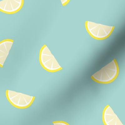 Little summer cocktail lemon slices fruit design yellow mint teal