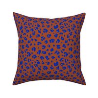 Neon panther pop art retro style animal print leopard skin design in brick red eclectic blue 
