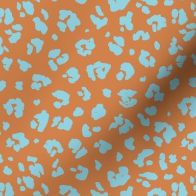 Neon panther pop art retro style animal print leopard skin design in caramel burnt orange aqua blue