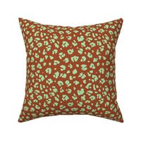 Neon panther pop art retro style animal print leopard skin design in lime green on red brick