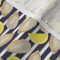 oysters and lemon slices on navy and white stripes 