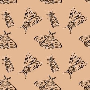 Tattoo styled inked black moth on beige pattern