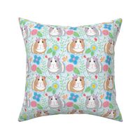 large guinea pigs and embroidered flowers on soft blue