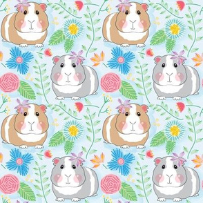 medium guinea pigs and embroidered flowers on soft blue