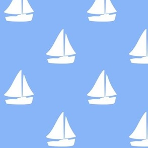 White sail boat on blue background