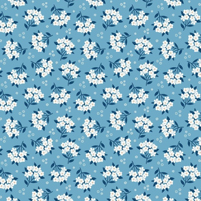 Spring morning blossom. Light blue background. Medium scale