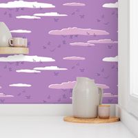 Seagulls Soaring Through the Clouds at Sunset - Monochromatic Purple