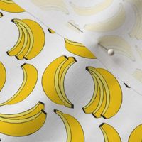 tiny geometric bananas on white