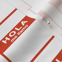 Cut-and-sew Spanish 'hola me llamo' nametags in red