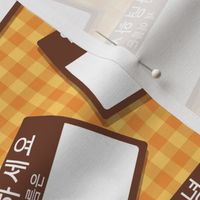 Scattered Korean 'hello my name is' nametags - brown on orange and yellow gingham