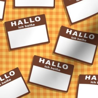 Scattered German 'hello my name is' nametags - brown on yellow/orange gingham