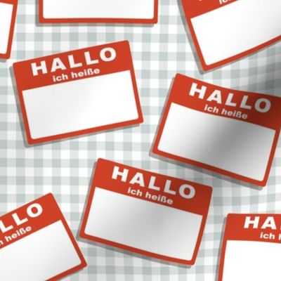 Scattered German 'hello my name is' nametags - red on grey gingham