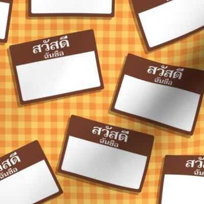 Scattered Thai 'hello my name is' nametags - brown on yellow-orange gingham