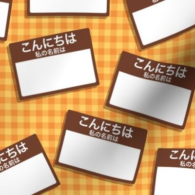 Scattered Japanese 'hello my name is' nametags - brown on yellow/orange gingham