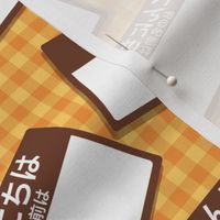 Scattered Japanese 'hello my name is' nametags - brown on yellow/orange gingham