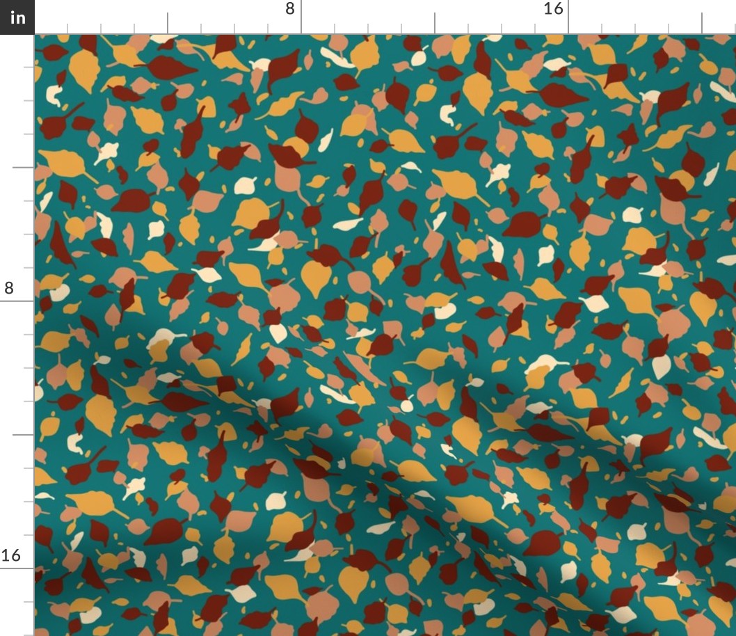 Fall leaves in brown, terracotta and yellow on teal