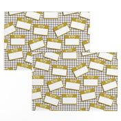 Scattered Hebrew 'hello my name is' nametags - mustard on grey gingham