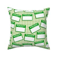 Scattered French 'hello my name is' nametags - green on gingham