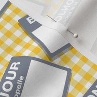 Scattered French 'hello my name is' nametags - grey on yellow gingham