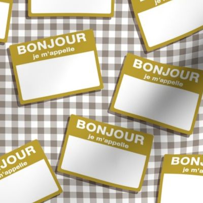 Scattered French 'hello my name is' nametags - mustard on grey gingham