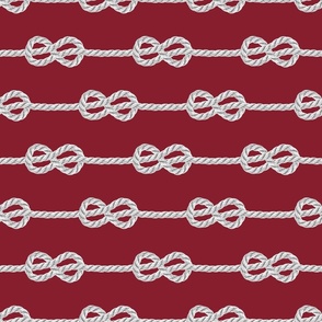 White rope knots horizontal dark red