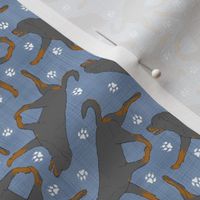 Tiny Trotting undocked Rottweiler and paw prints - faux denim