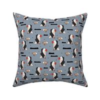 Geometric origami style puffin birds and fish winter kids design gray orange beige 