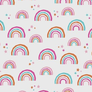 Paper cut rainbows multi color stars and magic sky dream design for kids pink orange girls on soft gray