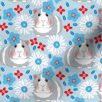 large guinea pigs with red white and blue flowers