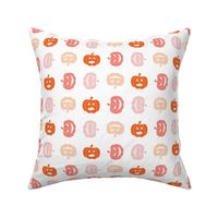 Pastel halloween jack o lanterns on white