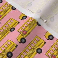 tiny school bus on pink