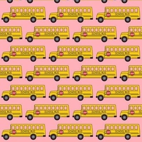 tiny school bus on pink