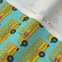tiny school bus on teal