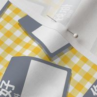 Scattered Chinese 'hello my name is' nametags - grey on yellow gingham